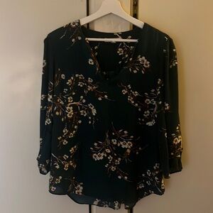 Green top with flower and branch detail